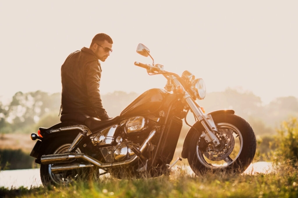 Man Standing at Motorcycle