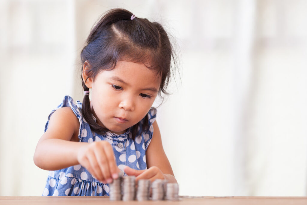 Child Counting Coins